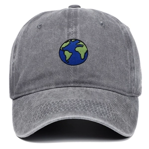 Macro detail of Earth embroidery and stitching on washed cotton baseball cap