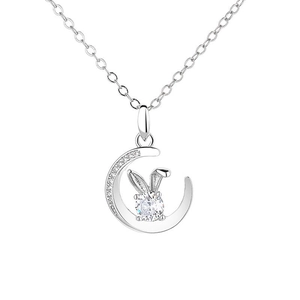 Silver crescent moon necklace with a sparkling rabbit-ear gemstone and diamonds