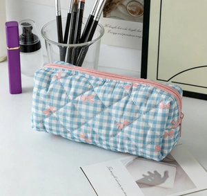 Light blue gingham quilted organizer pouch featuring pink bow prints and metal zipper