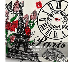 Detailed close-up of retro Paris Eiffel Tower and tulip print on canvas tote bag