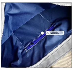 Detail view of the large canvas tote bag showing the inner zipper pocket and blue lining