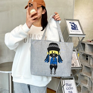 Chic light gray canvas tote bag with trendy cartoon print for daily shopping and casual use