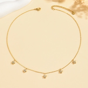 Luxurious 18K gold petal necklace with five zircon flowers on an elegant O-chain
