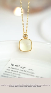 Macro shot of S925 silver square yellow crystal pendant with sparkling zircon accents