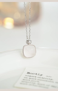 Detail of pink quartz square pendant with micro-pave zircon on a S925 silver chain