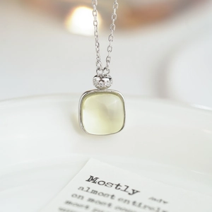 S925 sterling silver necklace with square yellow gemstone and zircon details on white tray