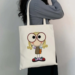 White canvas tote bag with cartoon girl print and long handles for shoulder use