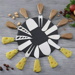 12-piece stainless steel cheese knife set with wood handles on a dark stone board