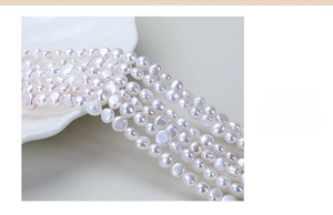 Macro shot of natural freshwater baroque pearls with lustrous white finish for DIY jewelry