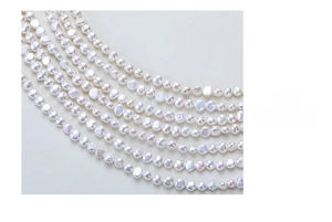 Macro detail of natural baroque freshwater pearl strands with high iridescent luster