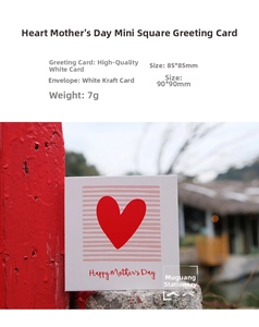Macro shot of a square Happy Mother's Day mini card with heart and kraft envelope