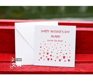 Close-up of Mother's Day square card with red hearts and Mummy You're The Best text