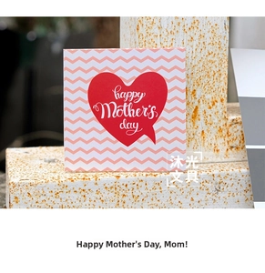 Close-up of square Mother's Day card with red heart design and wave pattern background