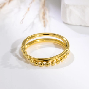 Minimalist double-layered gold bracelet with polished smooth ring and beaded chain details