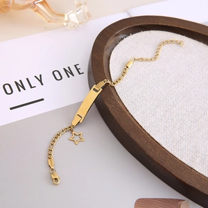 Gold-plated stainless steel ID bracelet with rectangular engravable bar and star charm