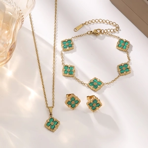 18K gold-plated titanium steel jewelry set featuring green leaf pendants and brushed finish
