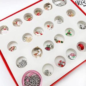 Detail of Christmas advent calendar jewelry set with alloy charms and two chains