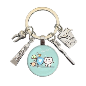 Creative dental keychain with tooth, toothpaste, brush and floss charms for dentists