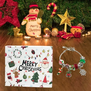 Detailed Christmas advent calendar box with 24 compartments and a festive charm bracelet