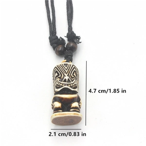 Detail view of Tiki totem necklace with dimension markings and adjustable woven cord