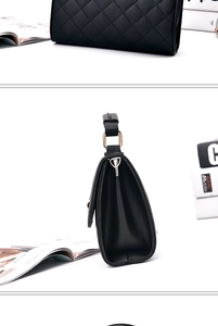 Detail showing black quilted leather crossbody bag with gold hardware and side fold design