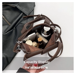 Interior view showing the storage capacity of the caramel leather mini crossbody bag