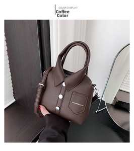 Detail of coffee brown polo shirt styled handbag with lychee texture and shoulder strap