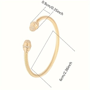 Golden twisted cable open cuff bracelet with rhinestone ends and size dimensions