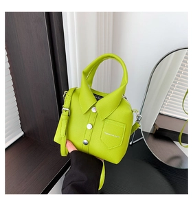 Detail view of neon green shirt-shaped handbag with litchi grain faux leather texture