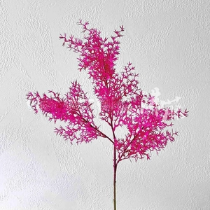 Detail of rose red artificial floral branch with long needle-like leaves for wedding decor