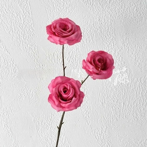 Detailed view of three-headed artificial pink roses made of high-quality silk fabric