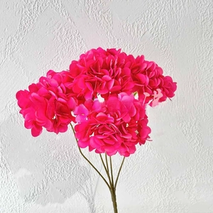 Detailed close-up of vibrant rose red silk artificial hydrangea for wedding decoration