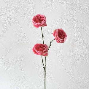 Detailed view of artificial pink roses with long stems for wedding and home decoration