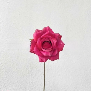 Detailed close-up of dark pink artificial silk rose petals with realistic layered texture