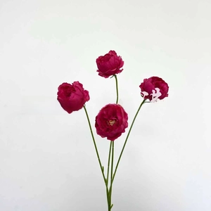 Detail of four-headed magenta artificial silk roses with vibrant petals and green stems