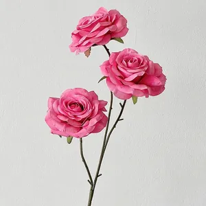 Three-headed magenta faux silk roses with long green stems for wedding aisle decoration