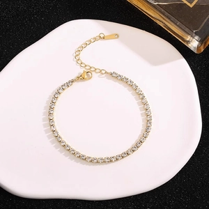 Elegant 4mm gold tennis bracelet with white cubic zirconia and adjustable chain