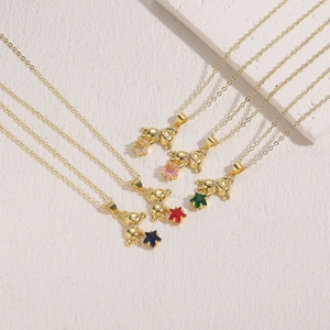 Minimalist gold teddy bear necklace collection featuring five colors of star shaped zircons