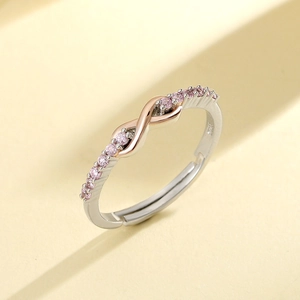 Polished S925 sterling silver infinity ring with sparkling pink cubic zirconia stones