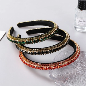 Baroque style padded headbands with emerald, ruby, and black crystals on velvet