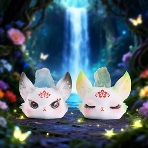 Macro detail of mythical fox cat figurines with crystals on magical forest background