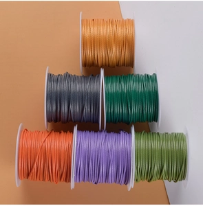 Macro shot of 1.0mm waxed polyester cords in six vibrant colors for DIY jewelry crafting