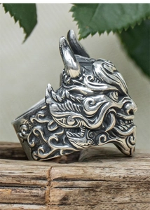Macro detail of vintage silver Mahakala ring showing intricate embossed relief texture
