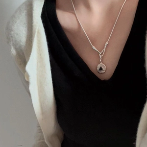 Elegant S925 sterling silver snake chain necklace with black triangle disc pendant