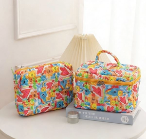 Macro shot of quilted colorful graffiti cosmetic bags set with teddy bear and smile patterns