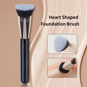Heart shaped foundation brush with rose gold ferrule and blue heart pattern bristles