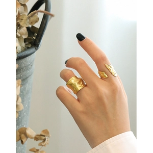 Irregular textured gold S925 sterling silver rings set worn on female hand