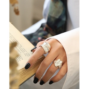 S925 sterling silver minimalist rings with irregular textured surface worn by model