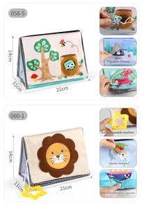 Detail of baby sensory cloth book with tactile textures, squeaker and star teether toy