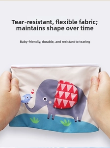 Tear-resistant baby cloth book showing durable fabric with cute cartoon elephant and bird